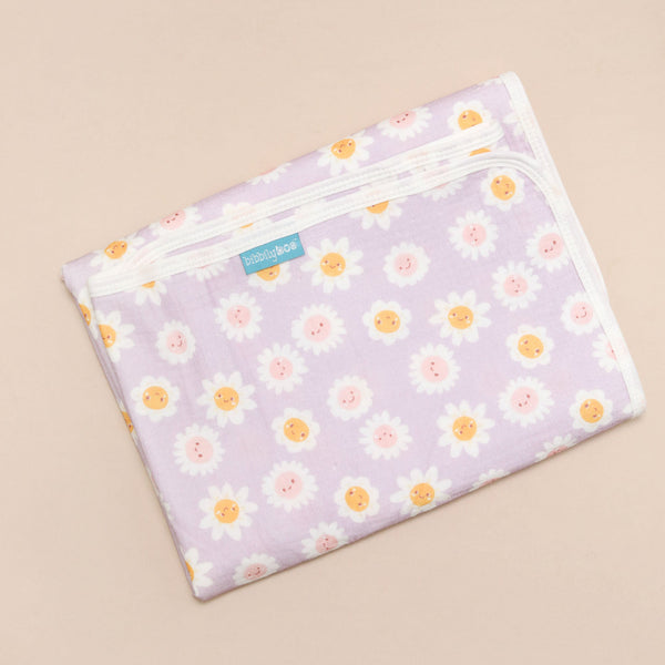 Floral-patterned changing mat on a beige background