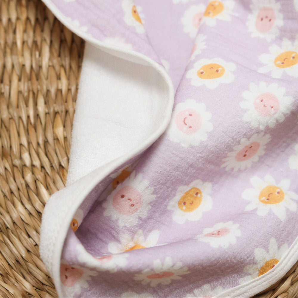 Floral-patterned changing mat on a beige background