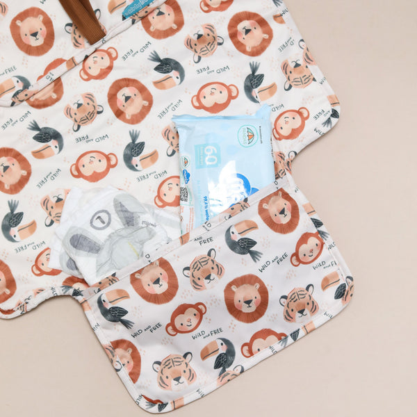 safari changing mat with animal pattern on a beige background