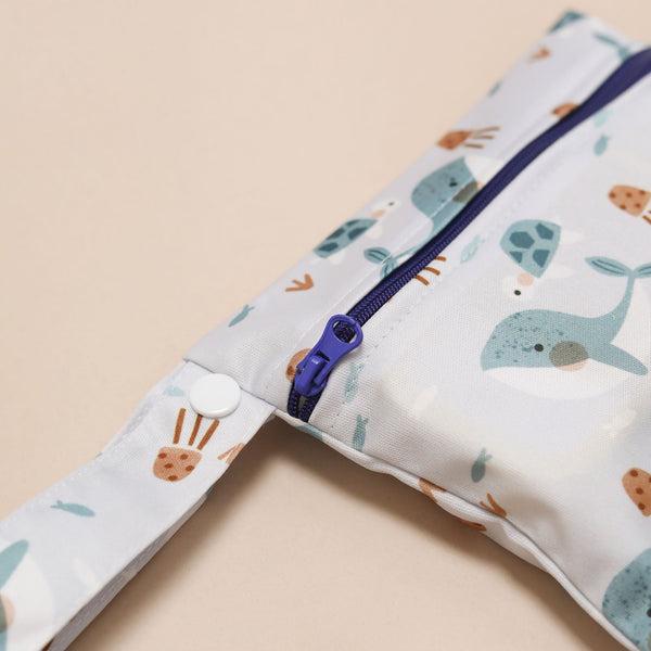Children's diaper bag with animal print on a beige background